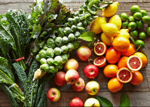 a group of fruits and vegetables on a wood surface Healthy Weight Loss Diets Coventry